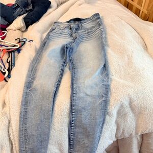 Buckle Light Wash Skinny Jeans